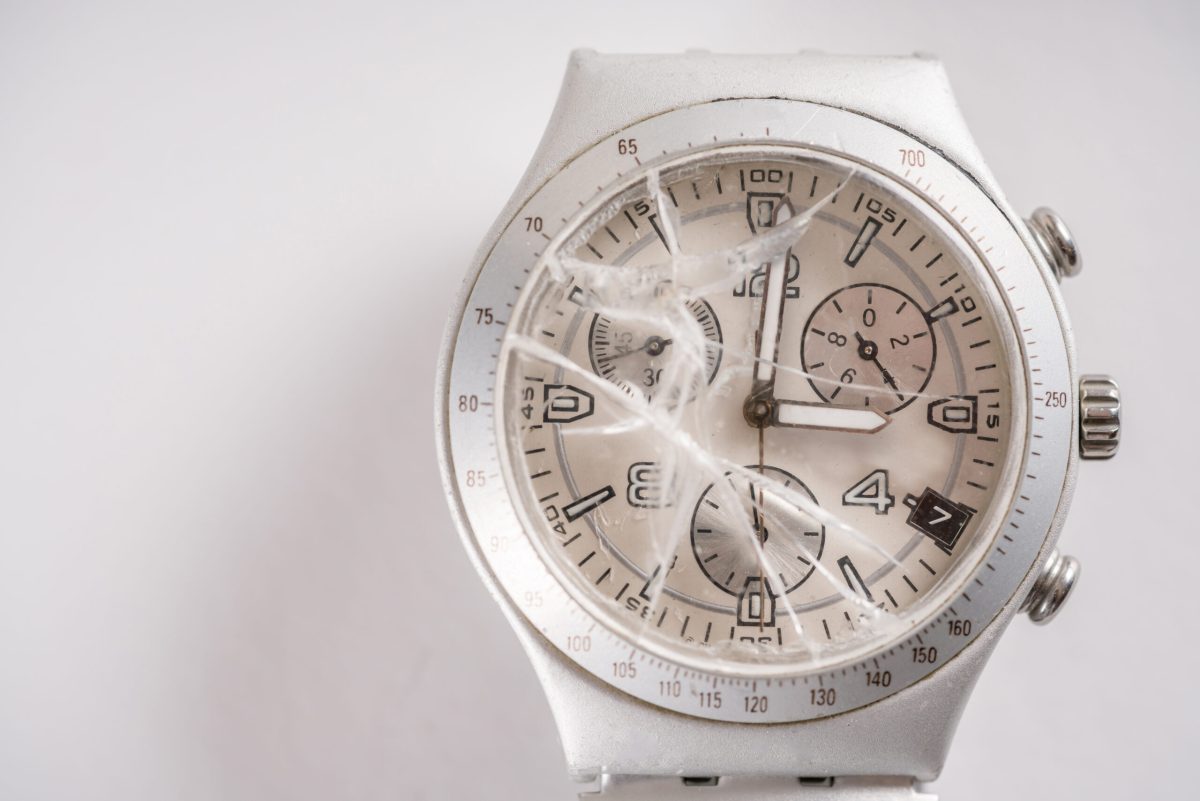 wristwatch destroyed glass with white background